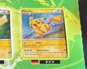 Pikachu World Collection card featuring Himeno's artwork with text in multiple languages