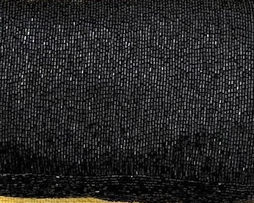 Close-up of the black beaded surface of the FENDI Mamma Baguette