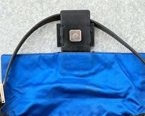 Silver hardware and leather strap of the FENDI Mamma Baguette